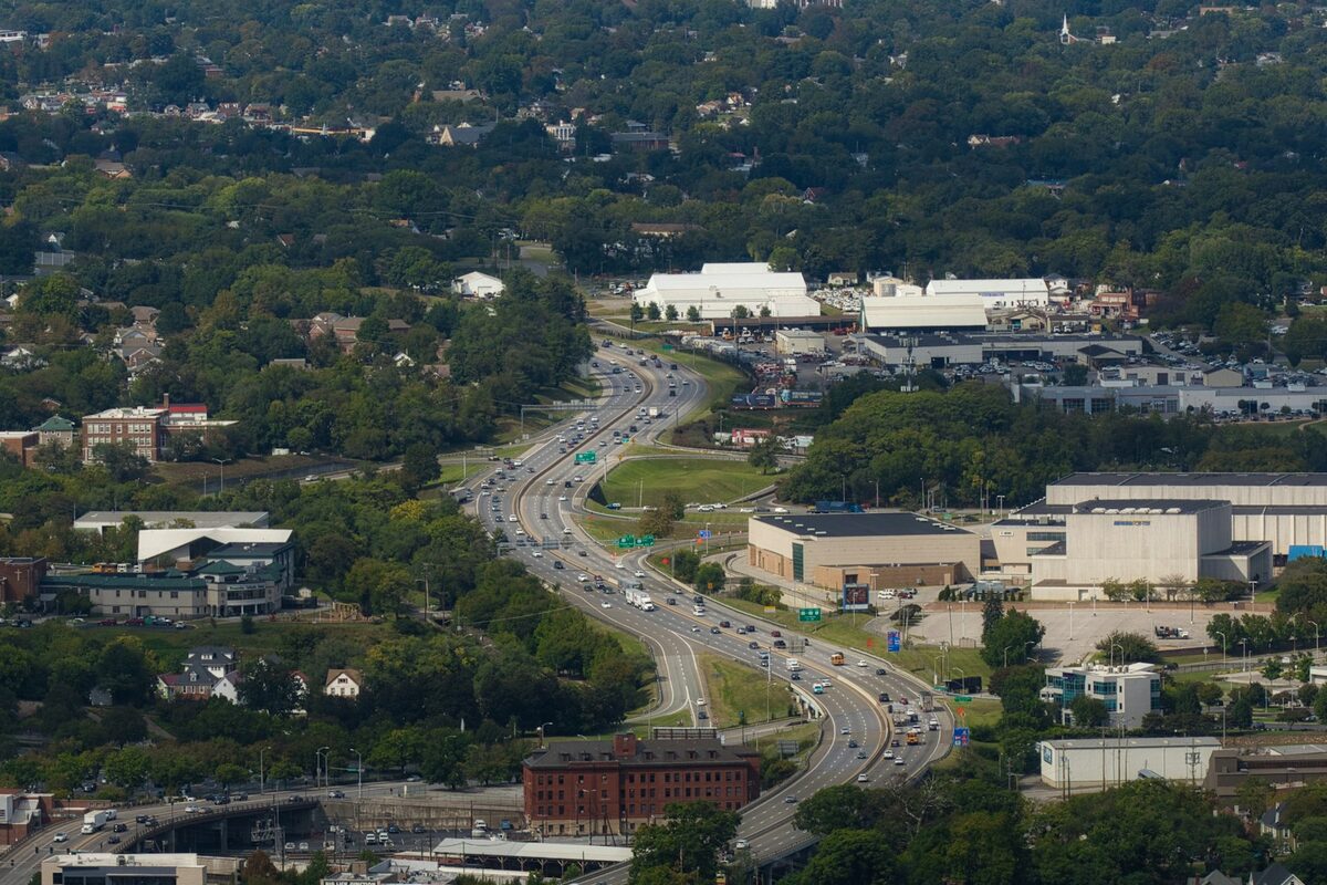 Illustrative aerial view of a highway through a suburban community