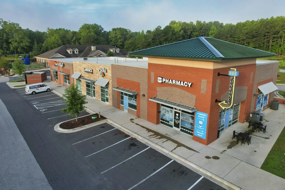 Illustrative aerial view of a suburban shopping and dining district