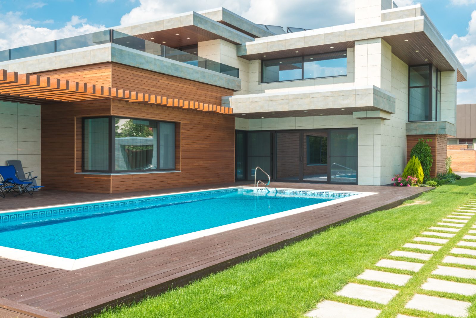 Contemporary custom home exterior with swimming pool