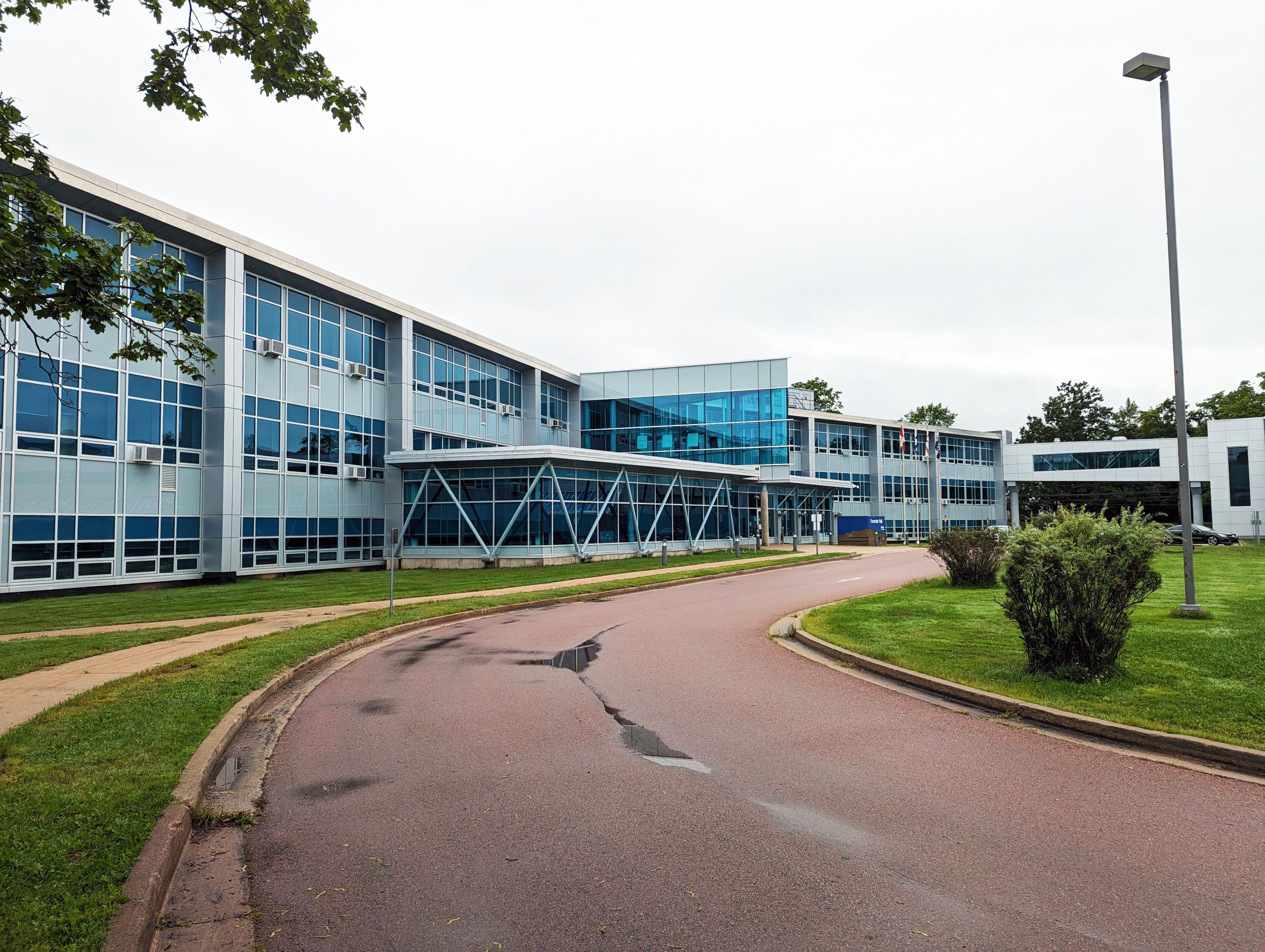A modern school building with a curved driveway