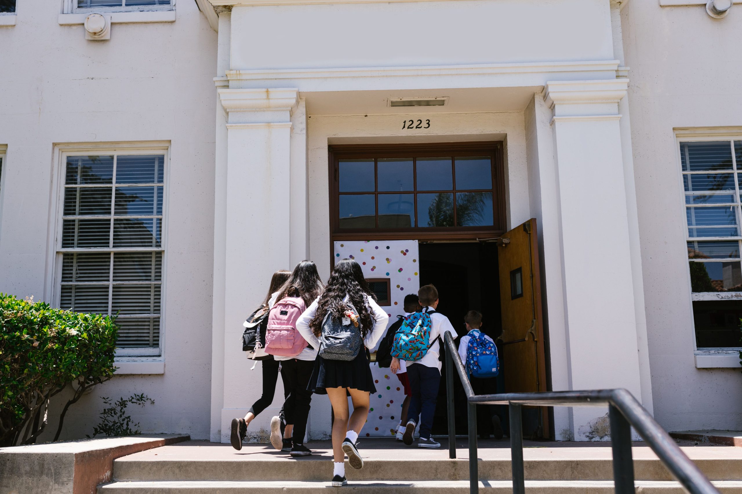 Students walking into a school building